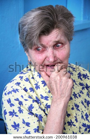 ZABOLOTTIA, UKRAINE - JUNE 11 - A sad old lady crying at shelter for single disabled people in Zabolottia on Julne 11, 2014.