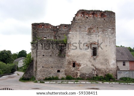 The aged destroyed city gate in the Ukrainian small town