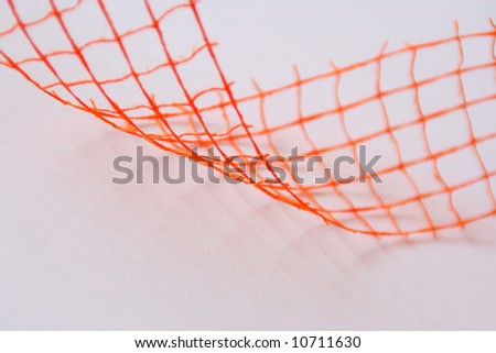 Closeup of orange wavy decoration (net, wire)