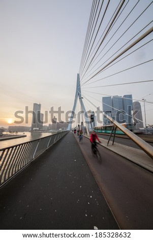 ROTTERDAM-APRIL 1, 2014. Erasmus Bridge over the Maas, de Rotterdam Building and Maas tower a sunrise, Rotterdam, the Netherlands.