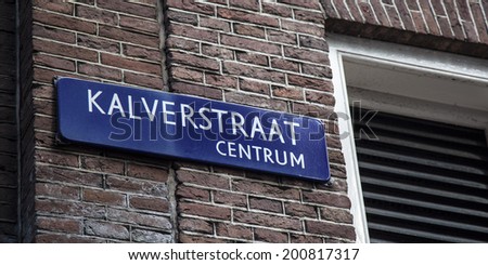 Amsterdam, Netherlands, 20 JUNE 2014: Name tag that refers to the Kalverstraat in Amsterdam centrum.