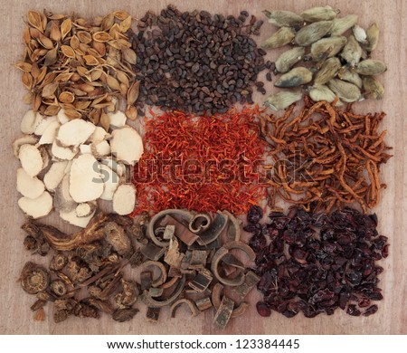 Traditional chinese herbal medicine selection over papyrus background.
