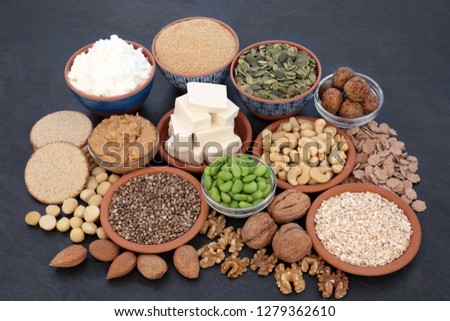 Health food for vegans with almond butter & yoghurt, tofu bean curd, grains, nuts, edamame beans, quinoa balls, oatmeal crackers & cereals. High in antioxidants, dietary fibre, vitamins & omega 3.