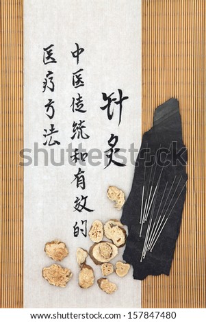 Acupuncture needles with atractylodes rhizome and mandarin script on rice paper over bamboo. Bai zu. Translation describes acupuncture chinese medicine as a traditional and effective medical solution.