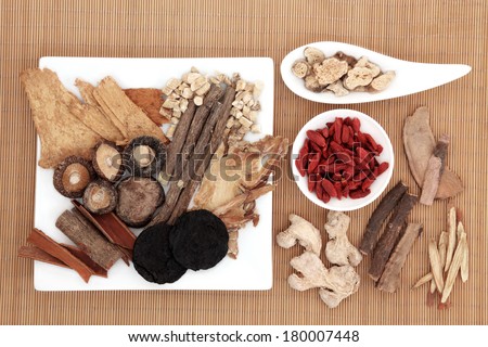 Chinese herbal medicine selection over bamboo background.