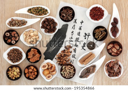 Acupuncture needles, chinese herbal medicine selection with calligraphy script on rice paper. Translation describes acupuncture chinese medicine as a traditional and effective medical solution.