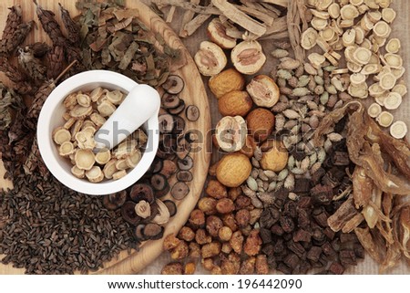 Chinese herbal medicine selection with a mortar and pestle.
