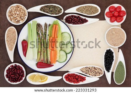 Large weight loss diet health food selection in porcelain bowls over parchment and brown paper background.