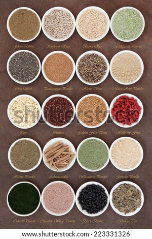 Body building powders and super health food in porcelain dishes over natural lokta paper background with titles.