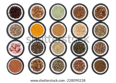 Liver detox health food selection in porcelain dishes on slate rounds and over white background.