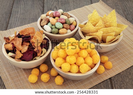 Savory snack party food selection in wooden bowls.