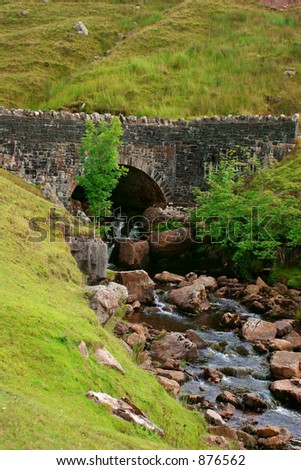 The Mountain Road bridge, straddling small waterfalls in the hills of the Brecon Beacons, National Park, Wales, United Kingdom.