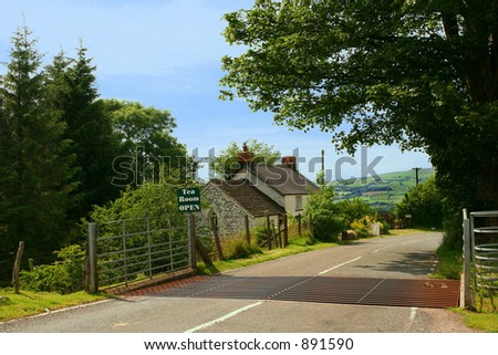 Quaint old tea rooms next to a road with a cattle grid set in the Brecon Beacons National Park, Wales UK.
