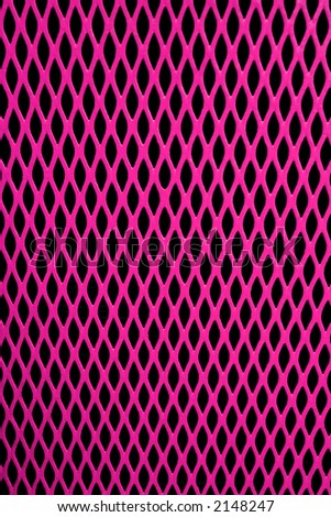 Pink metal grill of diamond shaped mesh, against black.