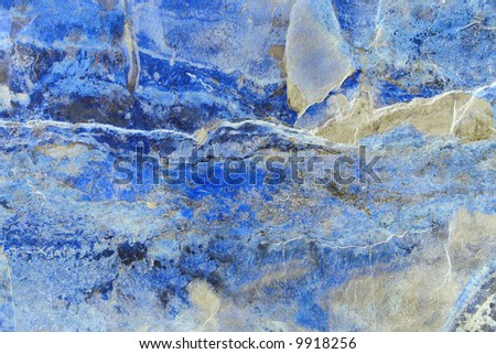 Abstract marble pattern on slate, in various shades of blue, white, cream and black.