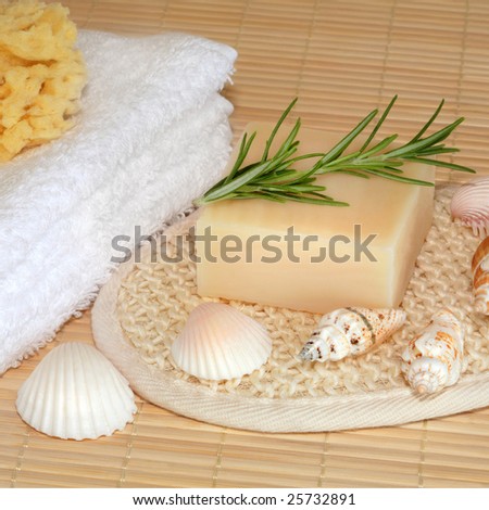 Natural skincare cleansing beauty products over bamboo mat background.