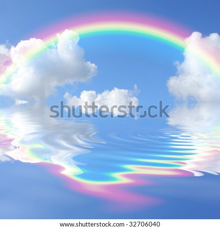 Rainbow fantasy abstract with reflection over rippled water set against a blue sky with clouds background.