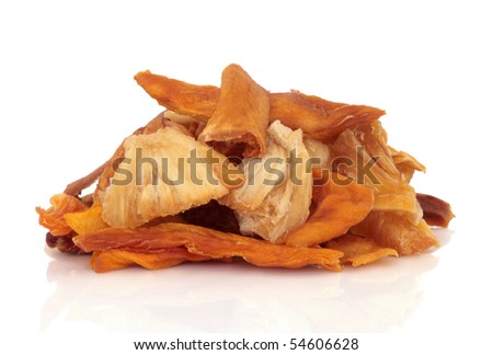 Mango and pineapple dried fruit snack mixture, isolated over white background.