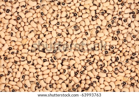 Black eyed pea pulses forming a textured background.