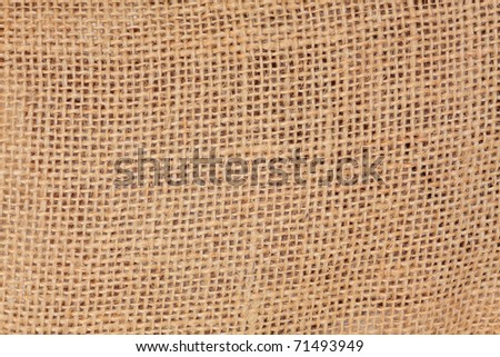 Hessian woven natural fibre forming a background.