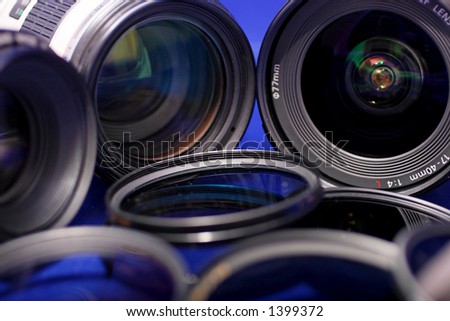lenses and photo filters on blue background