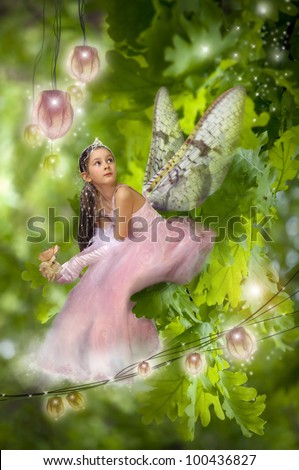 Sweet little fairy on the green branch.
