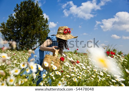 Sweet little girl pick wild flowers