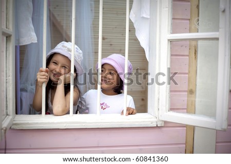 Sweet girlfriends on the window