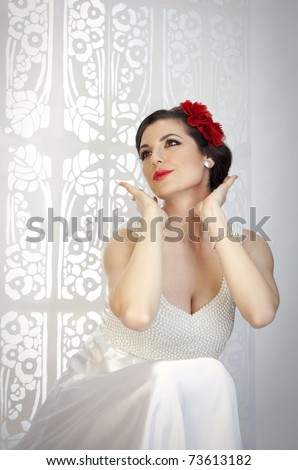 stock photo Beauty young lady in white wedding dress looking like Snow 