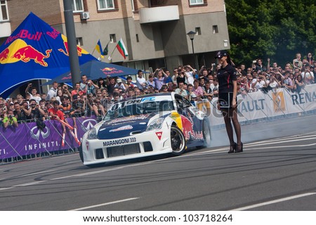 KIEV, UKRAINE - MAY 19: Ukrainian Drift Champion Alex Grinchuk drive the Nissan 350Z, Red Bull Racing Drift Team, Champions Parade, May 19, 2012 in Kiev, Ukraine