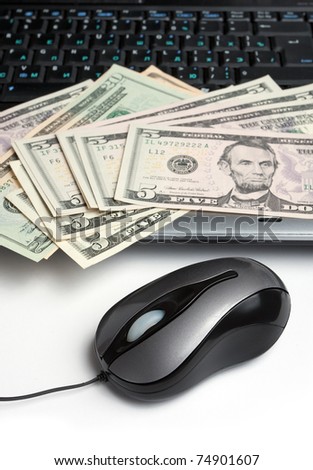 Laptop, mouse and money