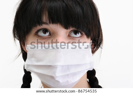 close-up of young woman in protective medical mask