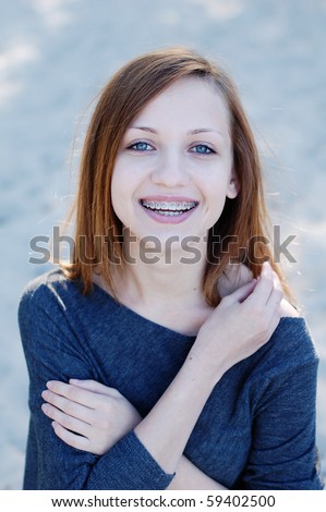 Girl with braces smiling cheerfully