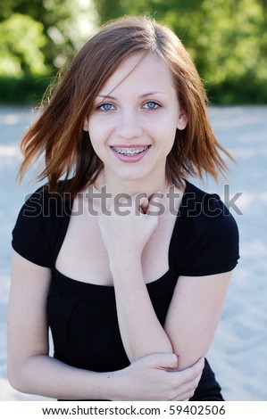 Beautiful girl wearing braces smiling cheerfully