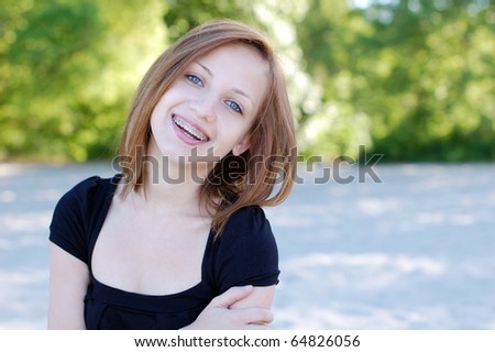 stock photo Charming girl wearing braces with a beautiful candid smile