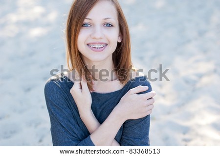 Pretty girl wearing braces smiling cheerfully