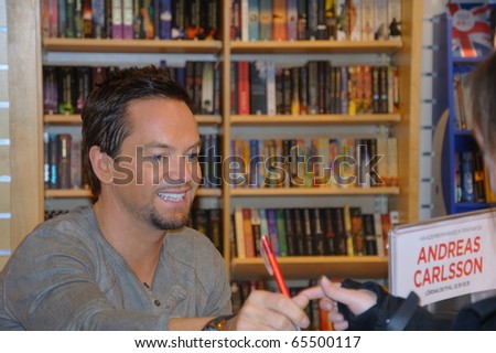 KARLSTAD, SWEDEN - NOV 20: Andreas Carlsson from the Swedish Idol 2010 Jury signs copies of his new book Dandy at the book store Akademibokhandeln on November 20, 2010 in Karlstad, Sweden
