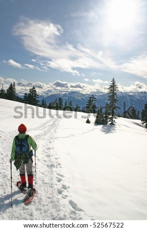 Women in the winter snow shoe hiking.