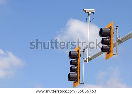 Secure camera with traffic light and sign.