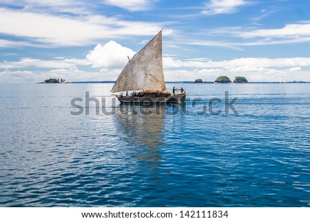 Nosy Be, Madagascar, Apr 4, 2008: Unidentified People On A Traditional Malagasy Dhow Transporting Goods Near Nosy Be, Madagascar On Apr 4, 2008