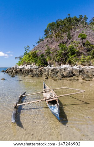 Outrigger canoe on the beach of Nosy Be, Madagascar