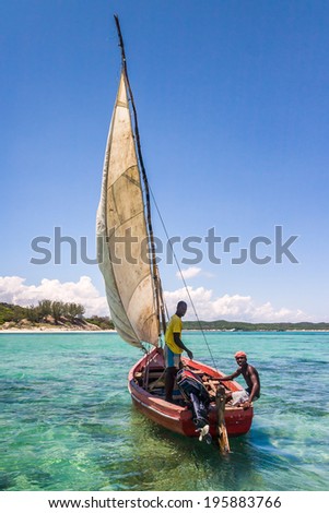 ANTSIRANANA, MADAGASCAR - NOV 19: Unidentified fishermen in a traditional fishing boat in the Emerald Sea of Antsiranana (Diego Suarez), north of Madagascar, on nov 19, 2008