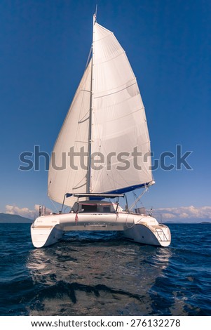 Luxury white catamaran floating in the ocean