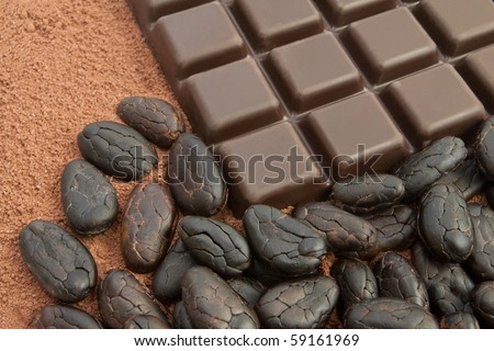 Bar of chocolate, cocoa powder and cocoa beans