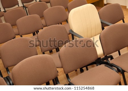 Manager chair stands out among the rows of ordinary office chairs