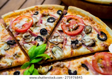 Large pizza on a wooden table Restaurant Large pizza on a wooden table Restaurant