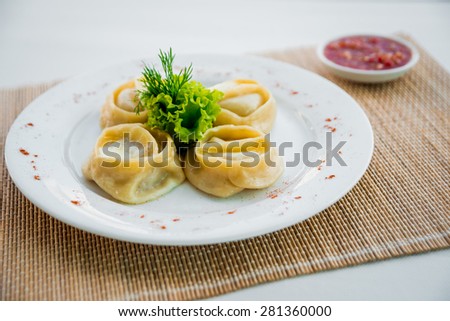Dish out the dough on lettuce leaves on a white plate. Restaurant