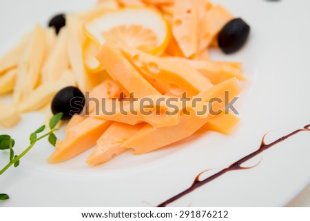 Pieces of cheese with olives. Restaurant