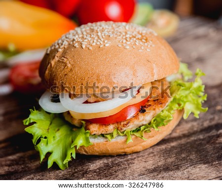 Beautiful big hamburger on a wooden table.