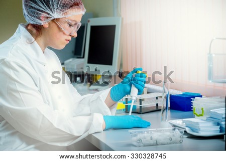 Medic staff at work in the laboratory. Background